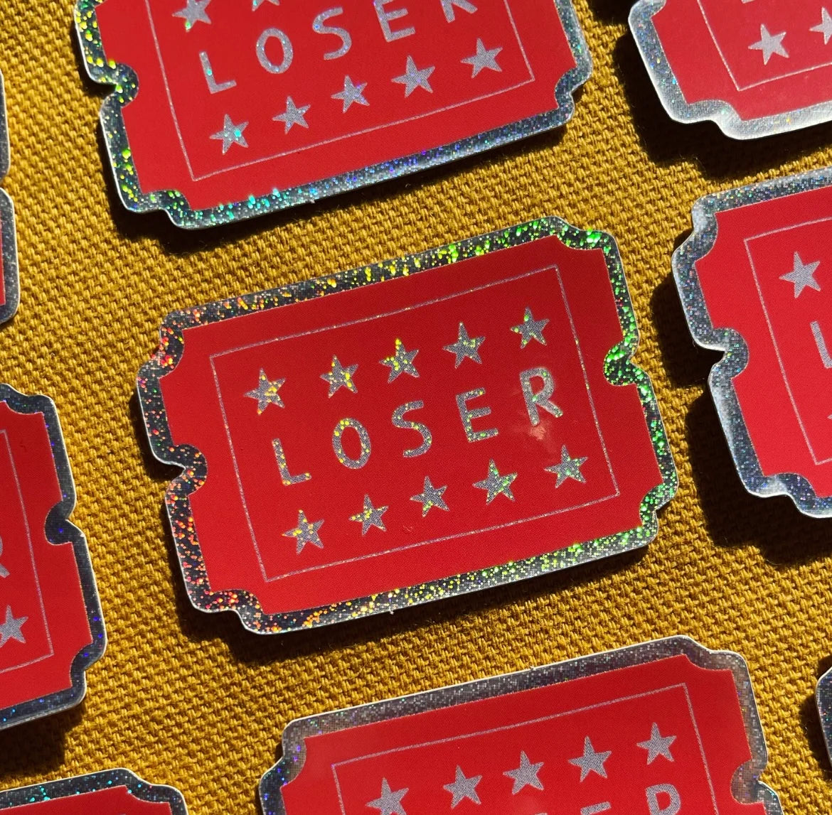 LOSER HOLOGRAPHIC STICKER by Ellastrated